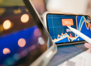 Trader working across multiple markets while analysing forex options alongside Bitcoin and Ethereum